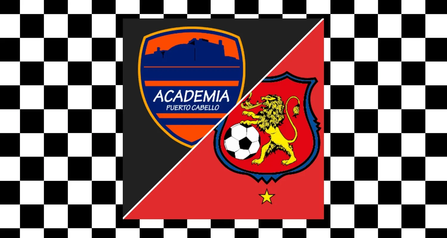 Puerto Cabello and Caracas players competing on the pitch during Liga FUTVE match.